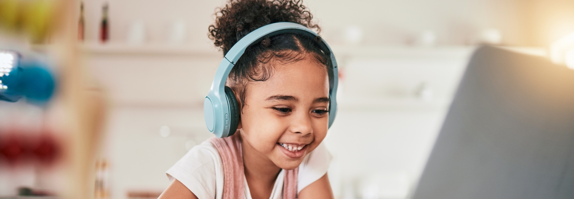Laptop, home education and happy child elearning, kindergarten homework or remote school work.